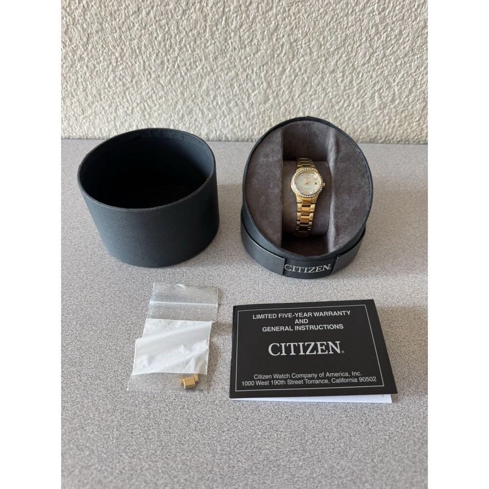 Citizen Eco-Drive E011-S096610 Women’s Gold Tone MOP Crystal Bezel Watch